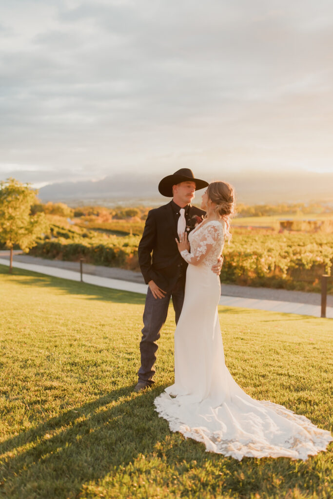 Bride and groom looking into each other's eyes during sunset bridals after their wedding ceremony in Utah, taken by Robin Kunzler Photo