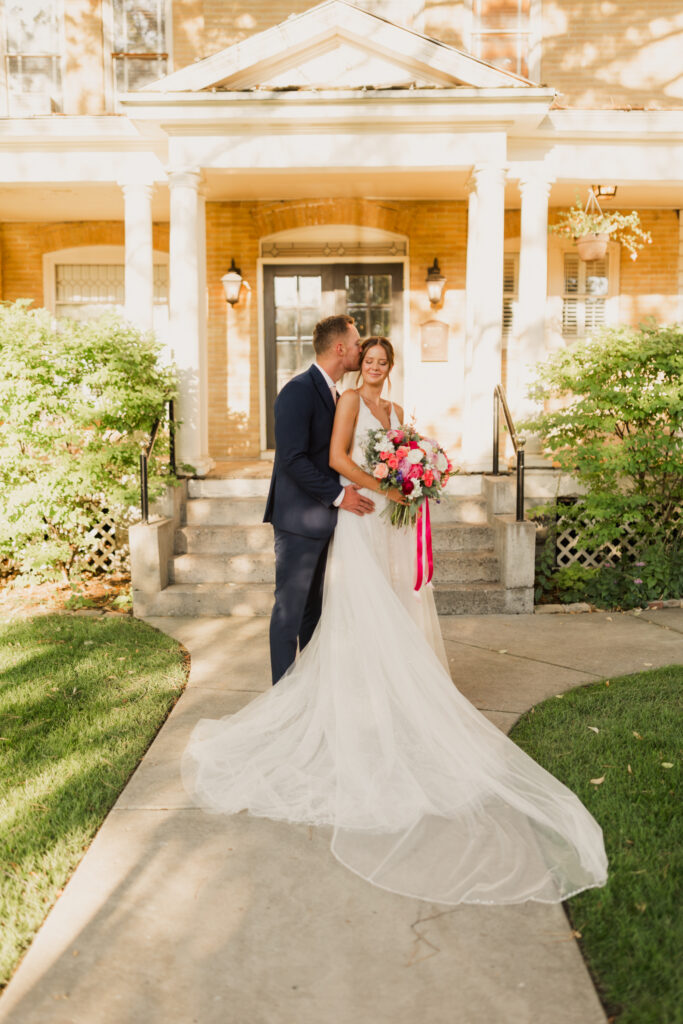 Groom kisses the Bride's temple after their ceremony at The Riter Mansion.