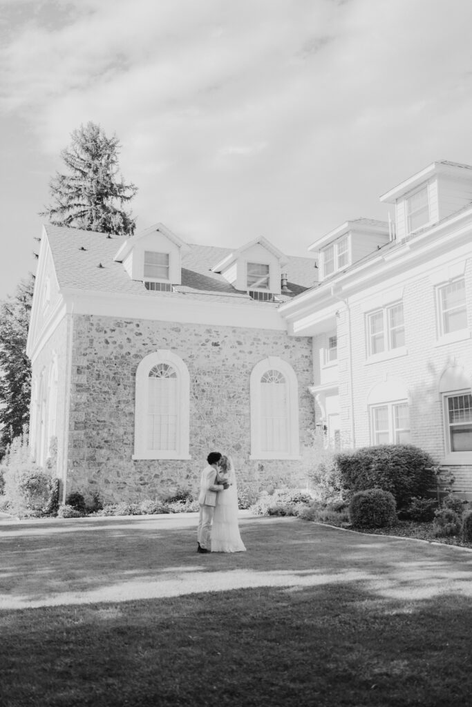 Bride and Groom kissing outside the Old Rock Church, one of the top 8 wedding venues in Northern Utah
