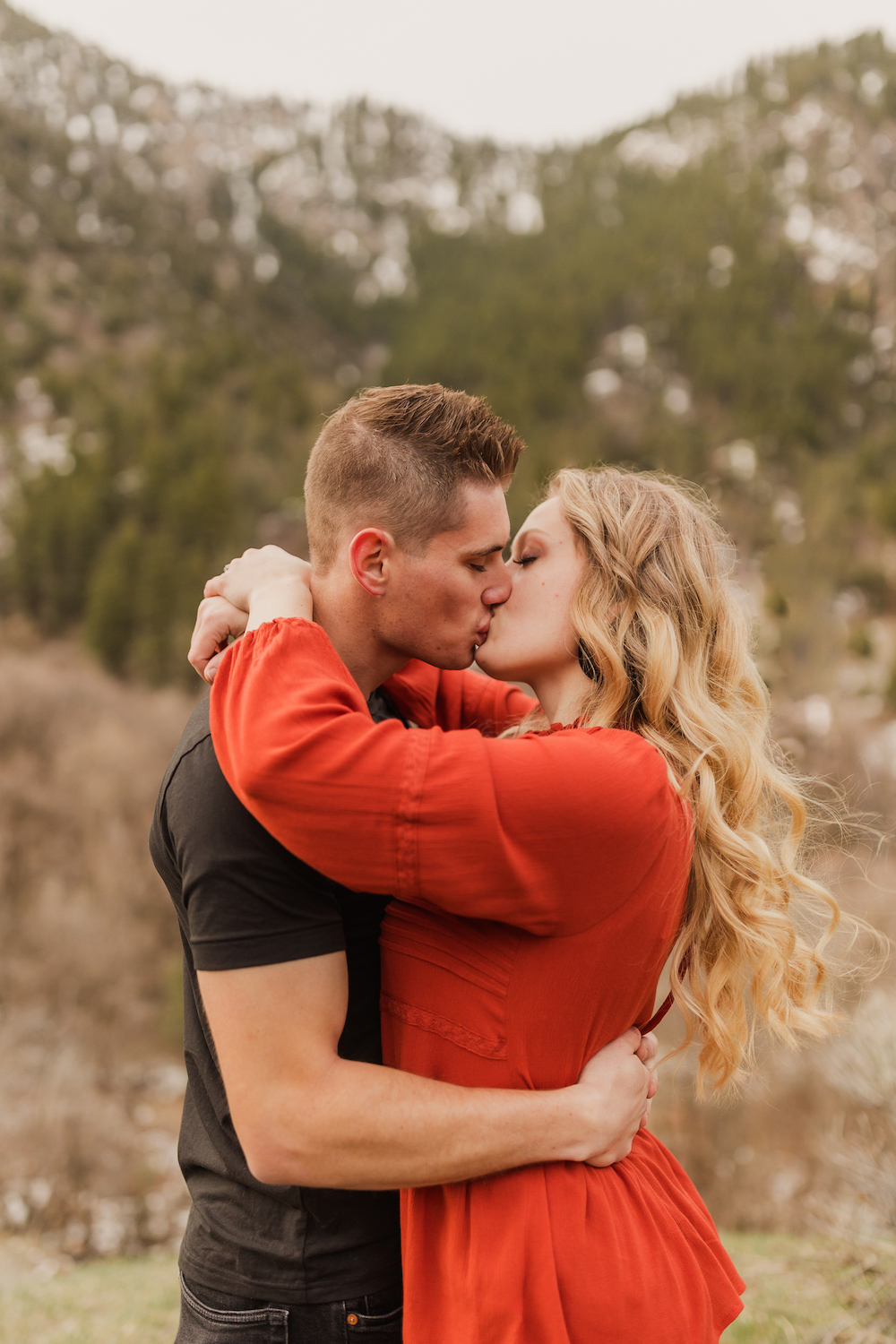 Couple sharing a kiss during their engagement session with Robin Kunzler Photo