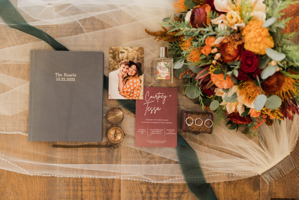 Wedding Invitation Flat Lay at Courtney and Tess's beautiful fall wedding at the Timbered Rose in Tremonton Utah